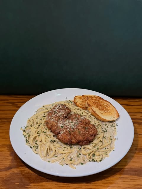 Steak over creamy pasta photographed for the Tonys Kitchen official social account